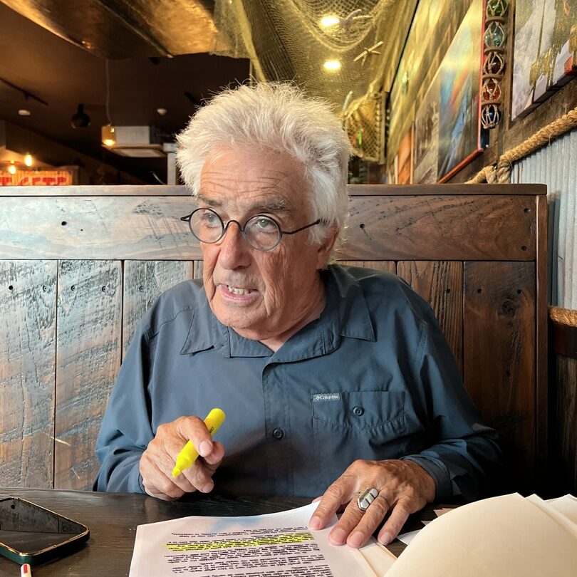 Still from Bill W Conscious Contact: an older man reading at a table