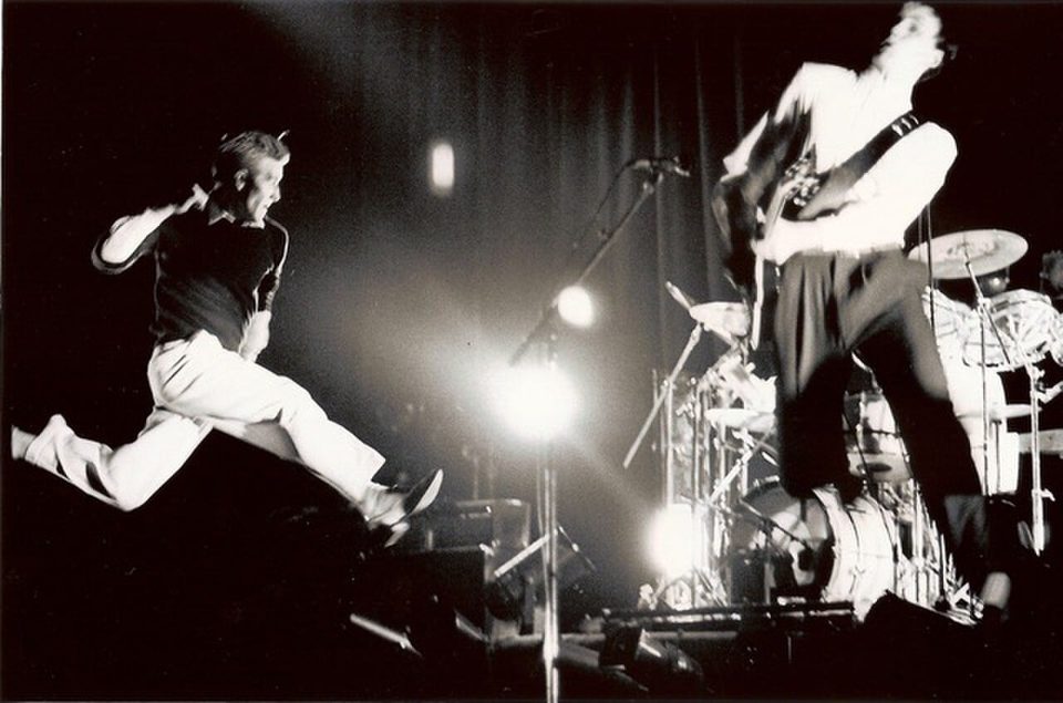 The Skids on stage in the 1970s, a singer mid-leap beside the guitarist